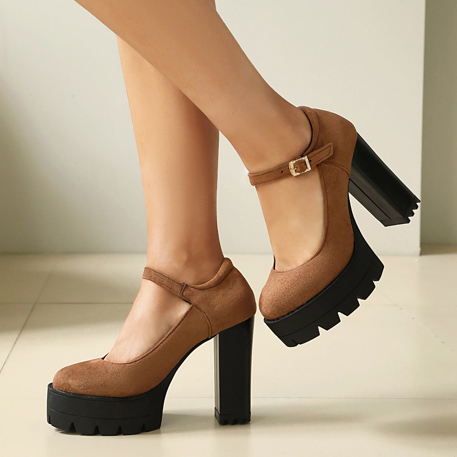 Platform Mary Jane block heel pumps with an instep strap