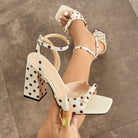 Mescini - Cream polka dot block heel sandal held in hand, toe band and bow view, US sizes