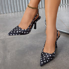 Mescini - Black polka dot satin slingback stiletto heels worn, side view, US women's sizes