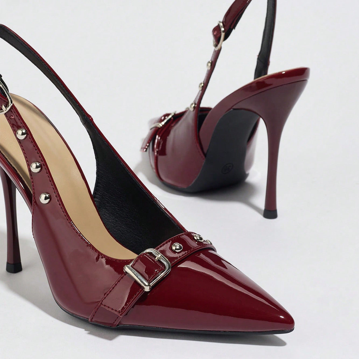 Mescini - Burgundy stiletto heels, close view of the buckle and studs, US women's sizes
