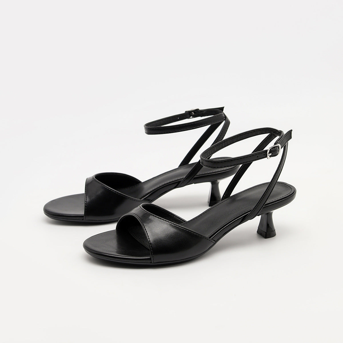 Mescini - Black ankle strap kitten heel sandals pair seen from the front angle, US women's sizes