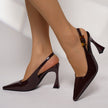 Mescini - Burgundy pointed toe slingback pumps worn with the heel raised, angled view, US