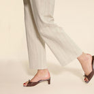 Mescini - Brown bow detail mules worn under pinstripe trousers, walking view, US sizes