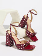 Mescini - Burgundy polka dot block heel sandal pair on a white riser, studio view, US