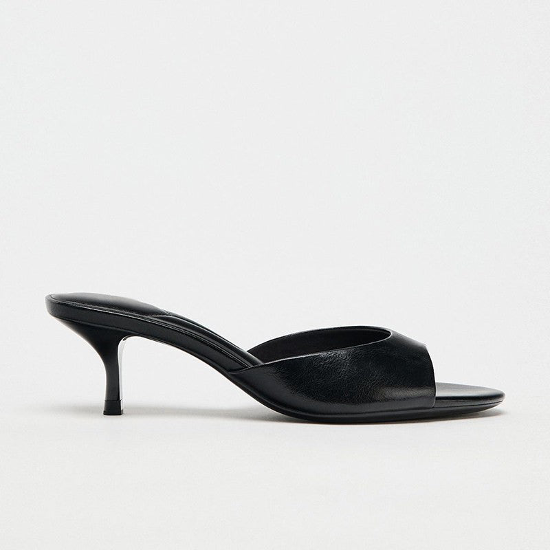 Mescini - Black kitten heel mule seen from the side, low flared heel view, US sizes