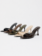 Mescini - Seven pointed toe mule heels lined up in every color, studio view, US sizes