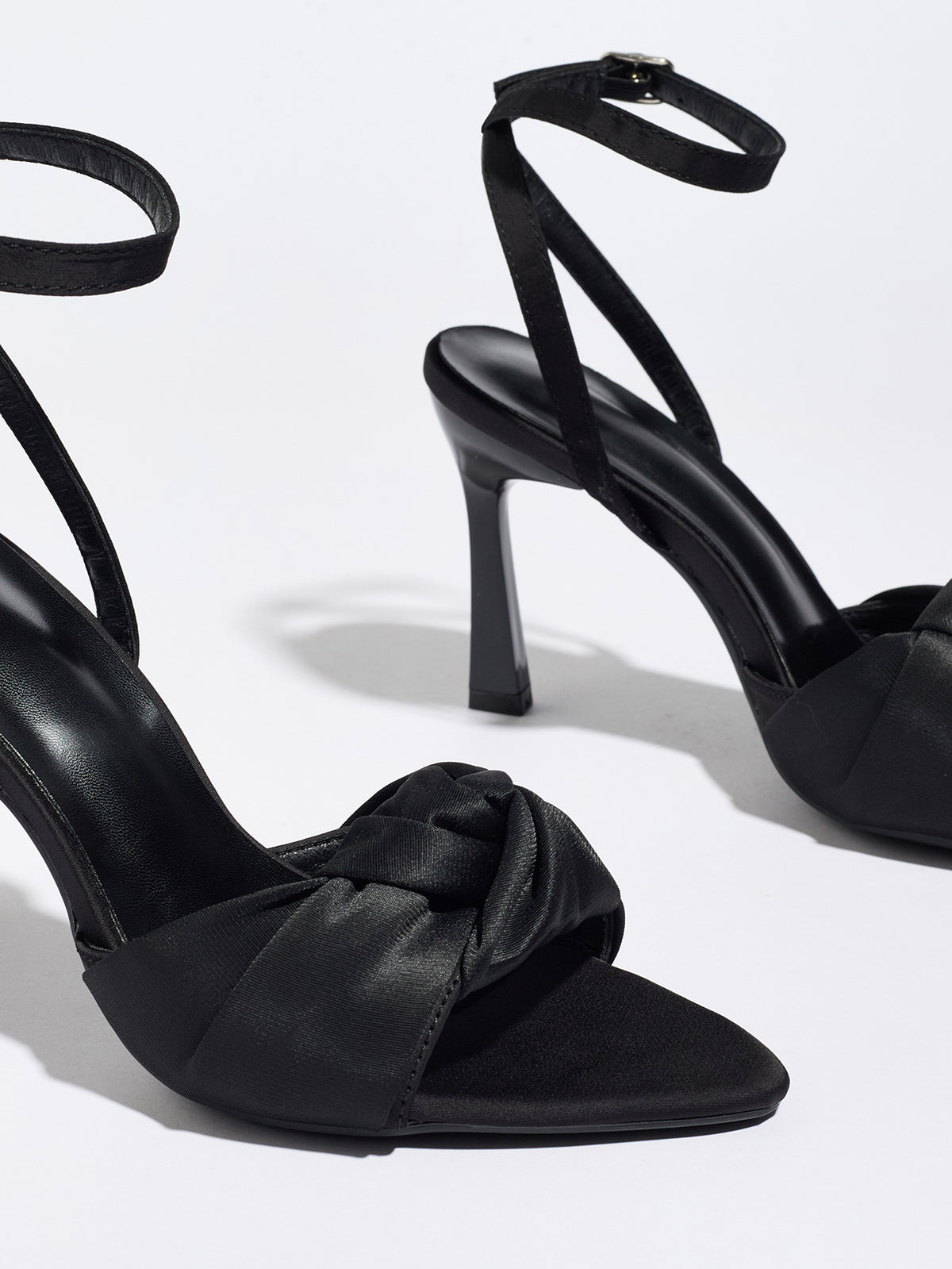 Mescini black knotted satin ankle strap sandals, close up of one shoe at an angle, US women's sizes