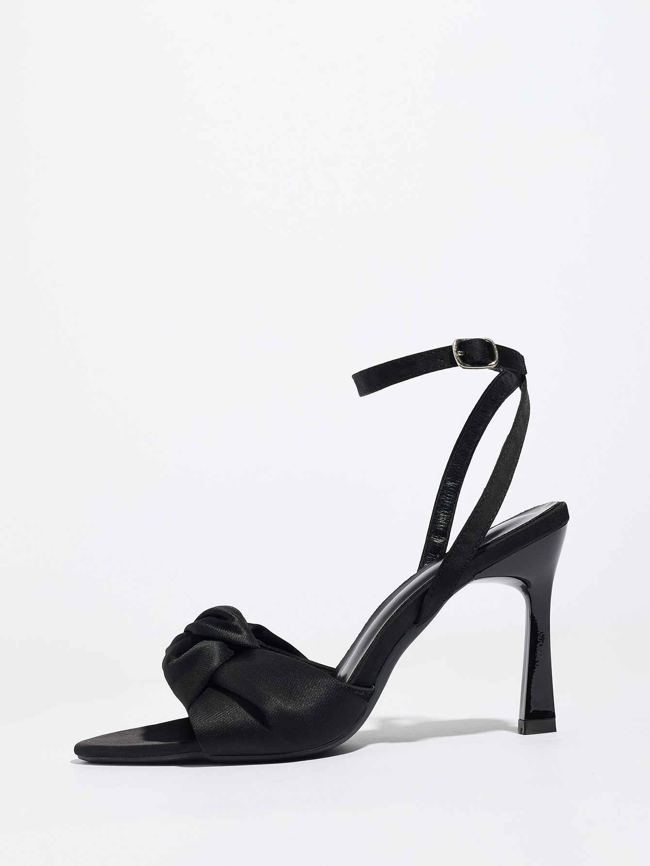Mescini black knotted satin ankle strap sandals, single shoe in profile on white, US women's sizes