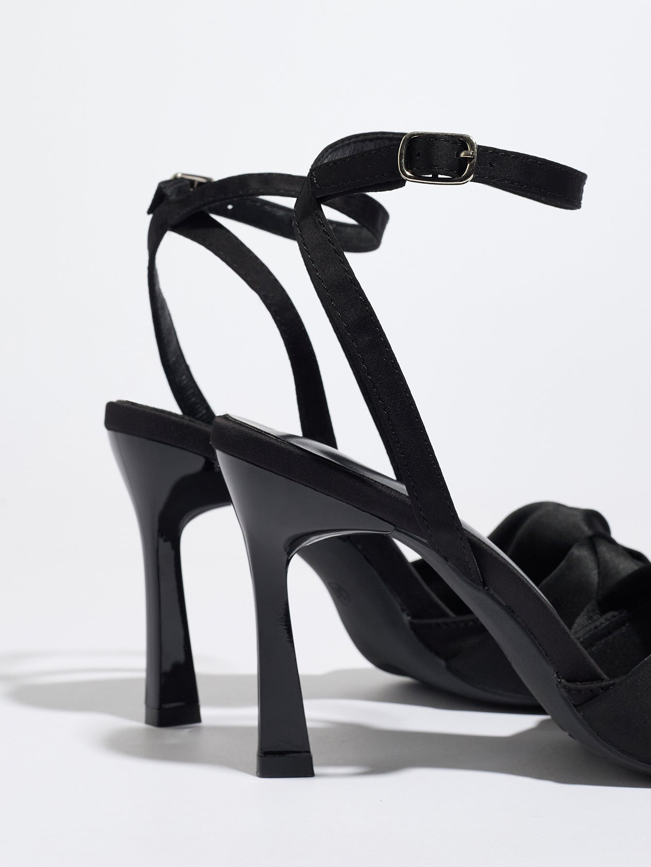 Mescini black knotted satin ankle strap sandals, rear view of the heel and buckle, US women's sizes
