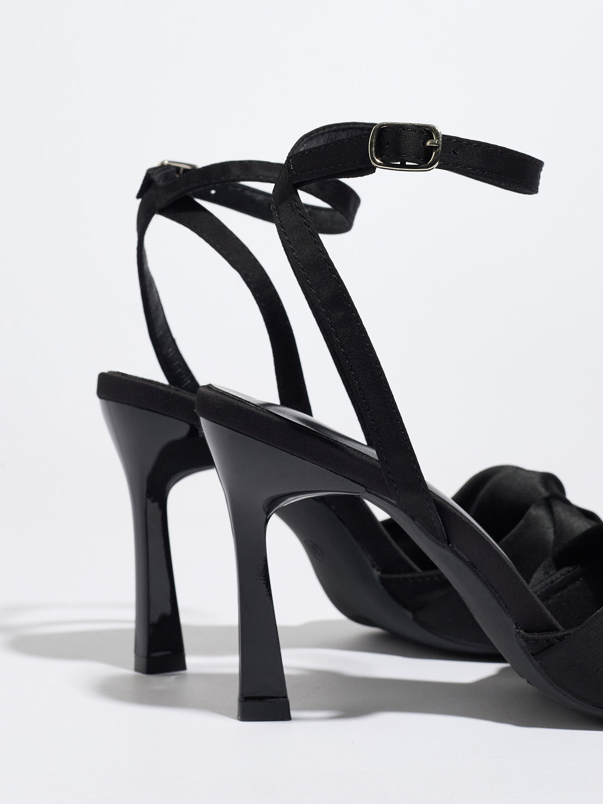 Mescini black knotted satin ankle strap sandals, rear view of the heel and buckle, US women's sizes