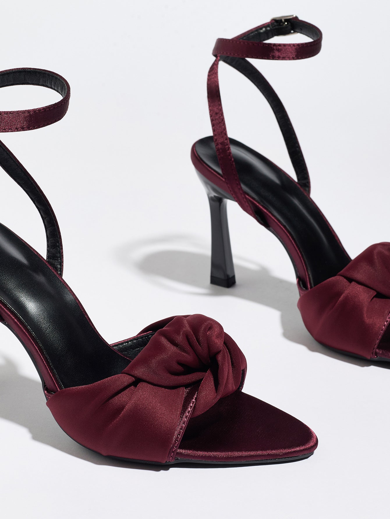 Mescini burgundy knotted satin ankle strap sandals, close up of the knot over the vamp, US women's sizes