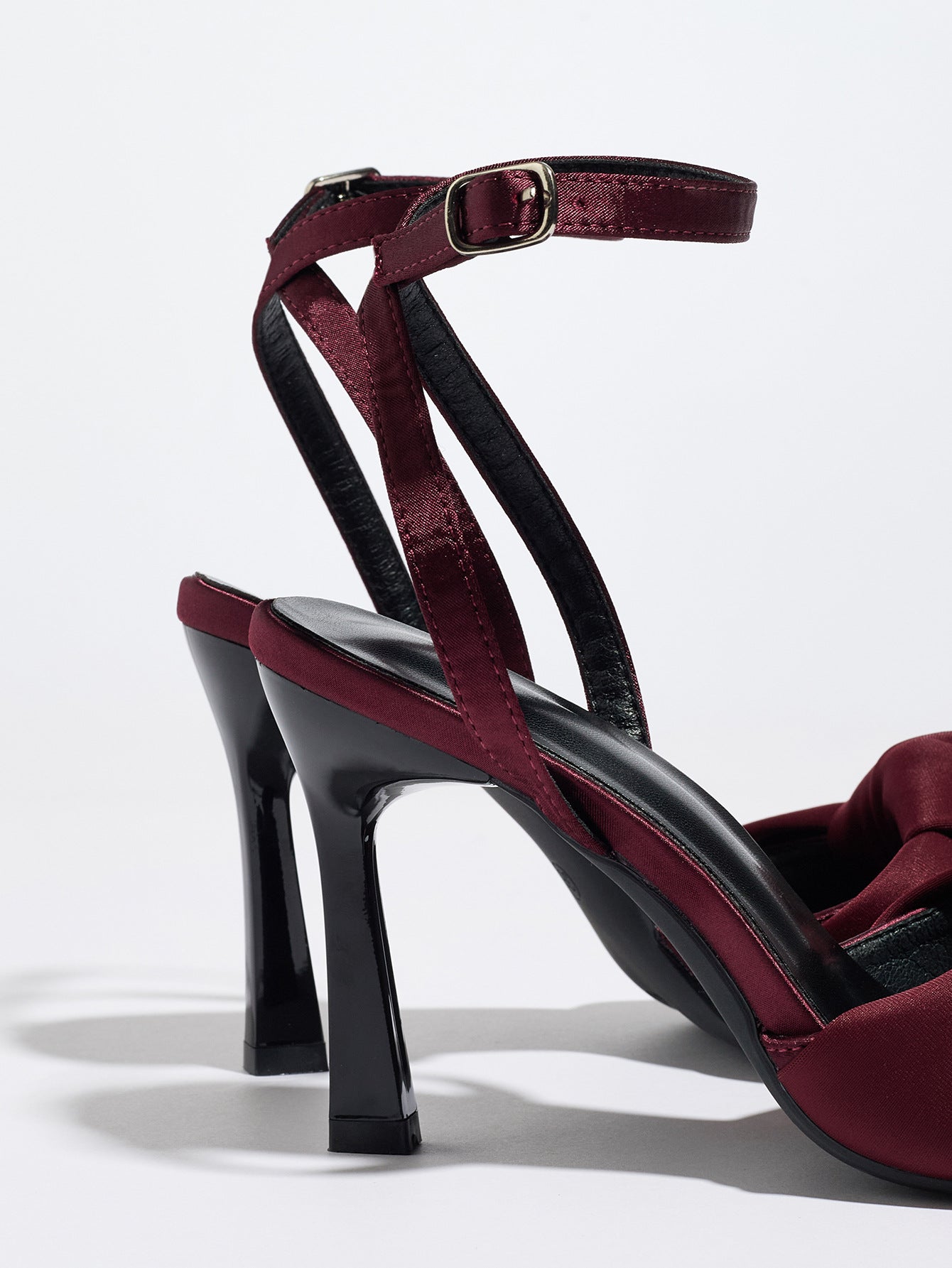 Mescini burgundy knotted satin ankle strap sandals, rear view with the slim heel in focus, US women's sizes