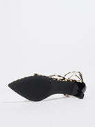 Mescini leopard print strappy heeled sandal on its side, close view of the outsole, US women's sizes