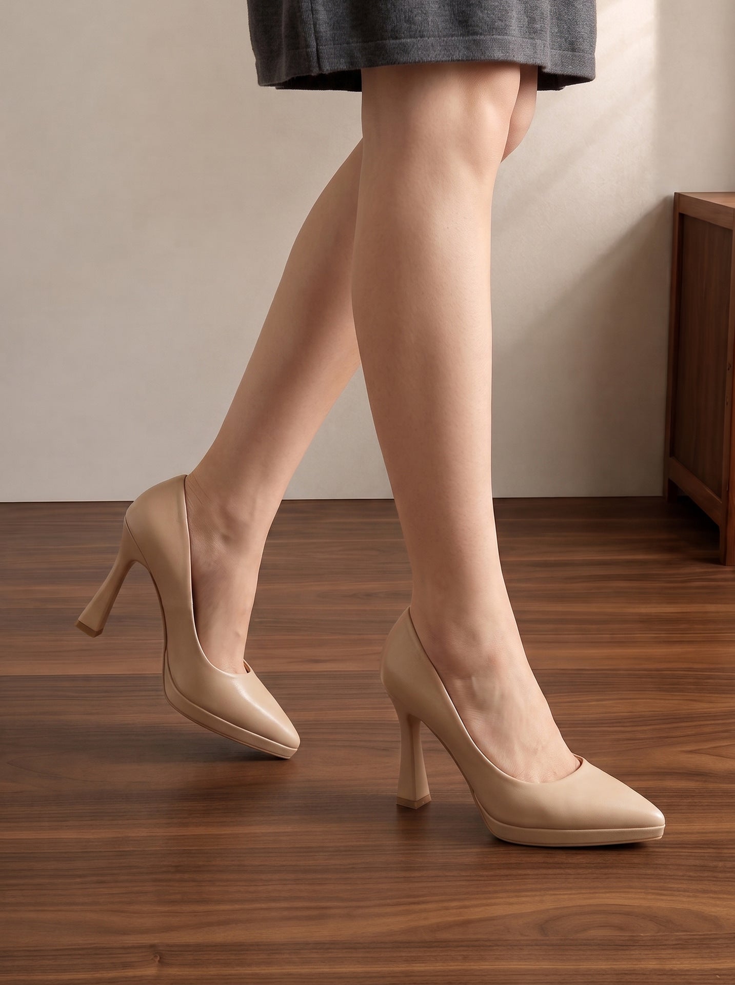 Mescini nude sculpted heel pointed toe pumps, worn with one foot lifted in step, US women's sizes