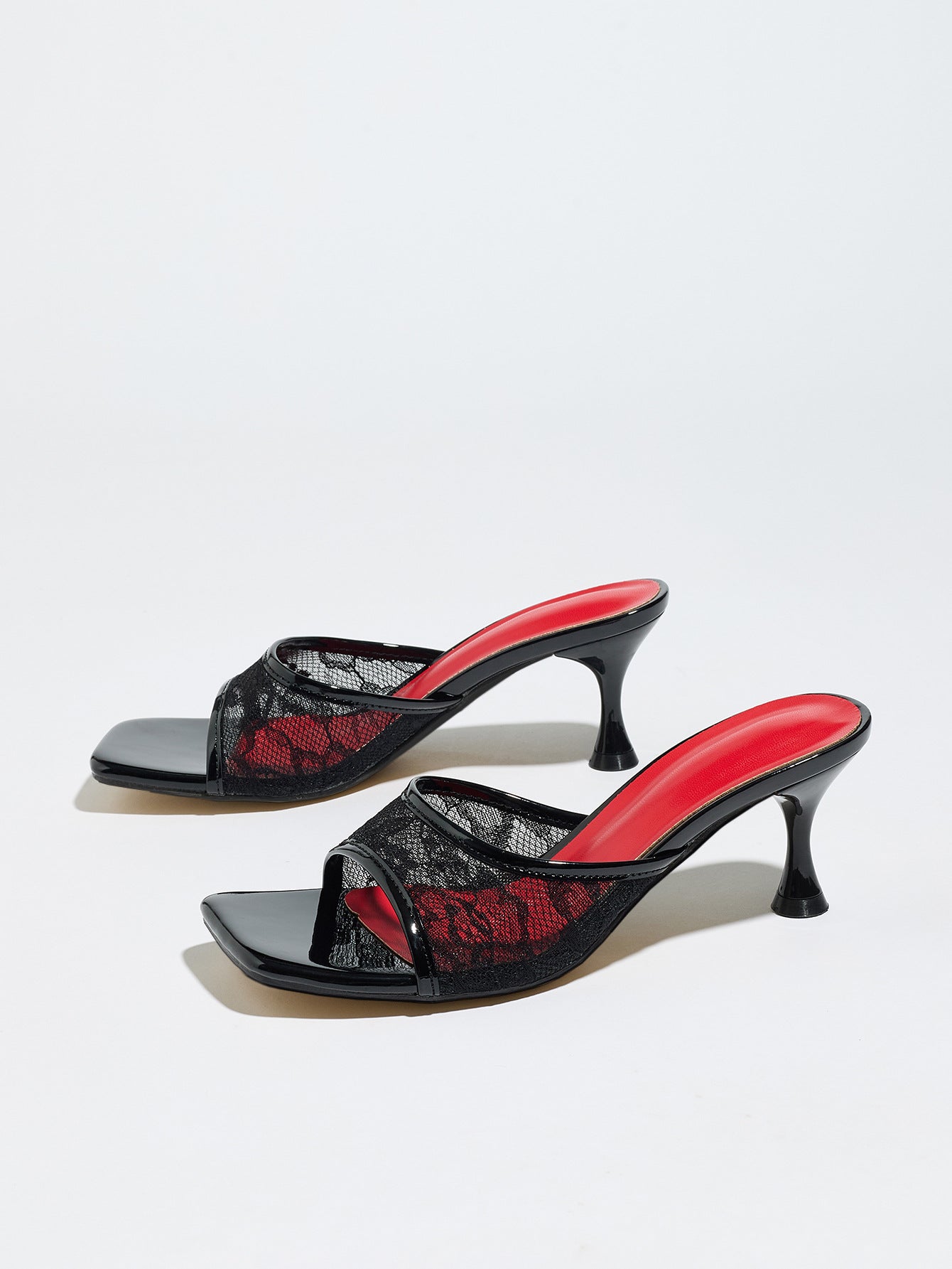 Mescini black lace mesh square toe mule heels, pair angled on a grey background, US women's sizes