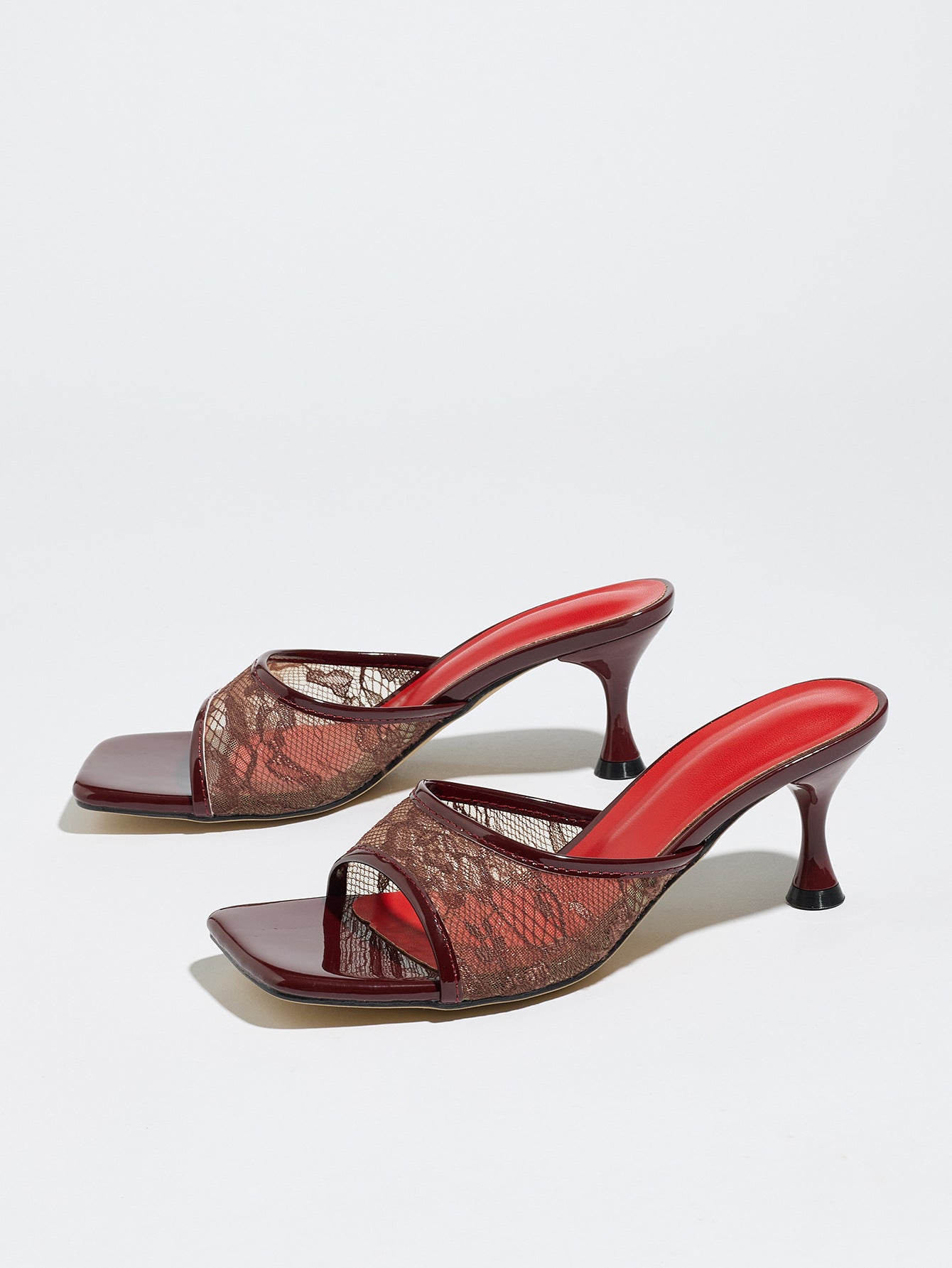 Mescini burgundy lace mesh square toe mule heels, pair angled on a pale backdrop, US women's sizes