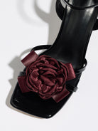Mescini black rosette square toe strappy sandals, close up of the burgundy flower, US women's sizes
