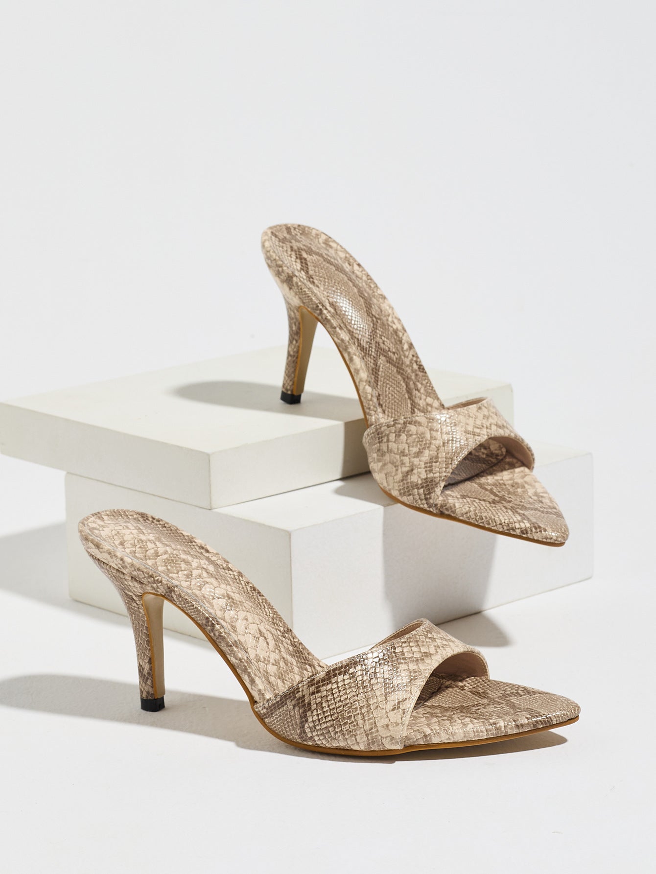 Mescini apricot snake print pointed toe mule heels, the pair on white blocks, US women's sizes