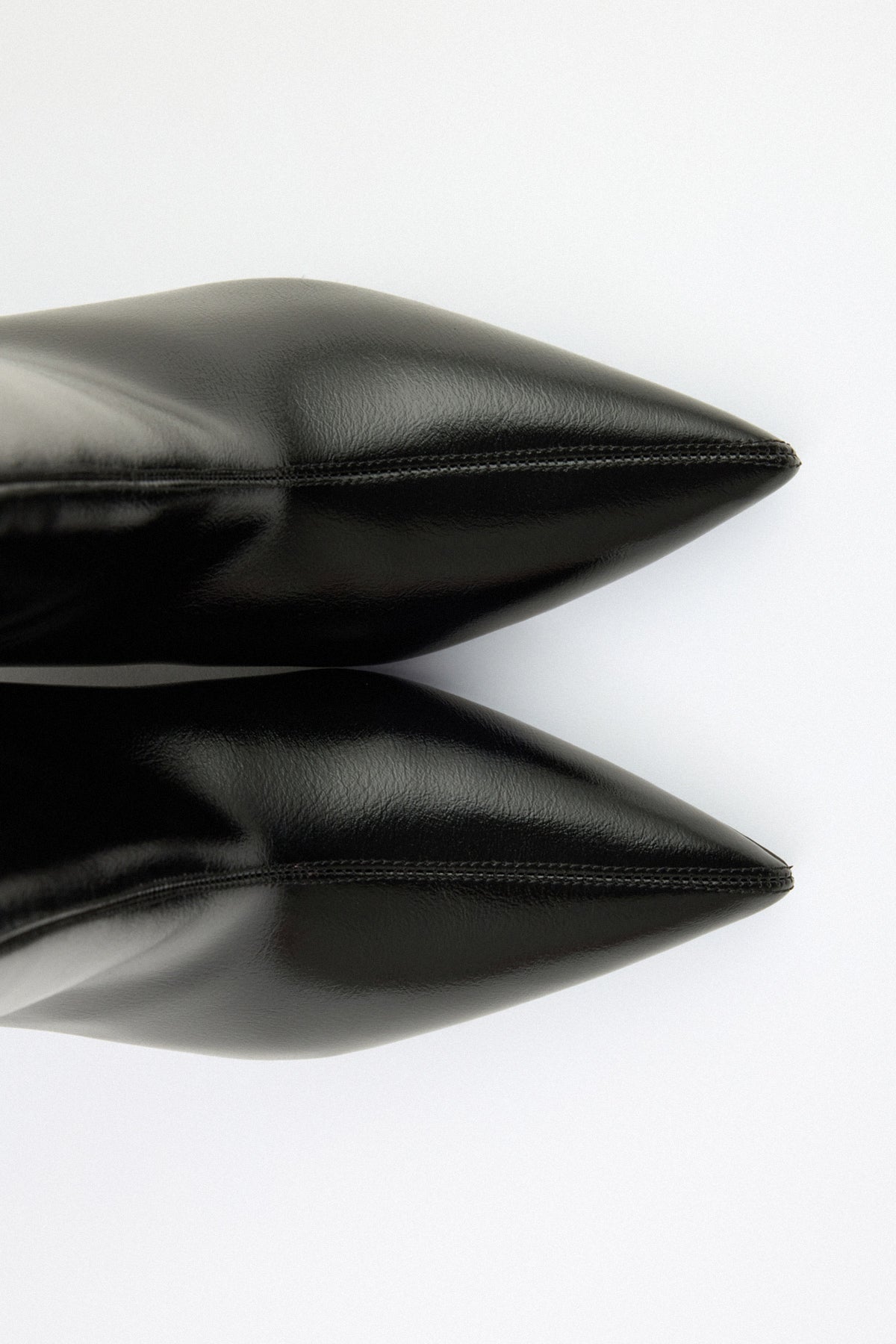 Mescini black pointed toe ankle boots, pair seen from above, shafts open, US sizes