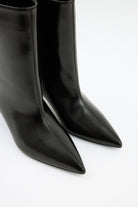 Mescini black pointed toe ankle boots, side view of the curved heel, US size guide