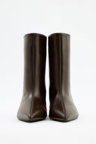 Mescini dark brown pointed toe ankle boots, front view with the seam centred, US sizes