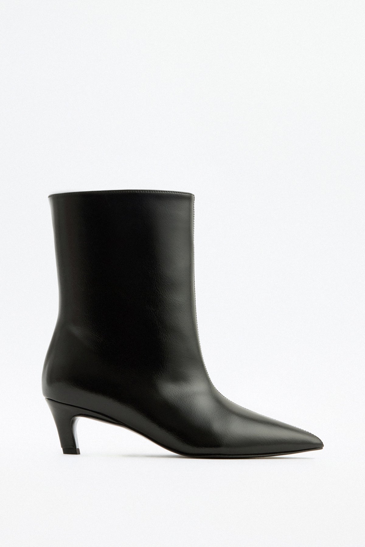 Mescini black pointed toe ankle boots, full side view on a studio backdrop, US sizes