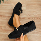 Mescini black tassel loafer flats, close view of the vamp band and stacked edge, US women's sizes