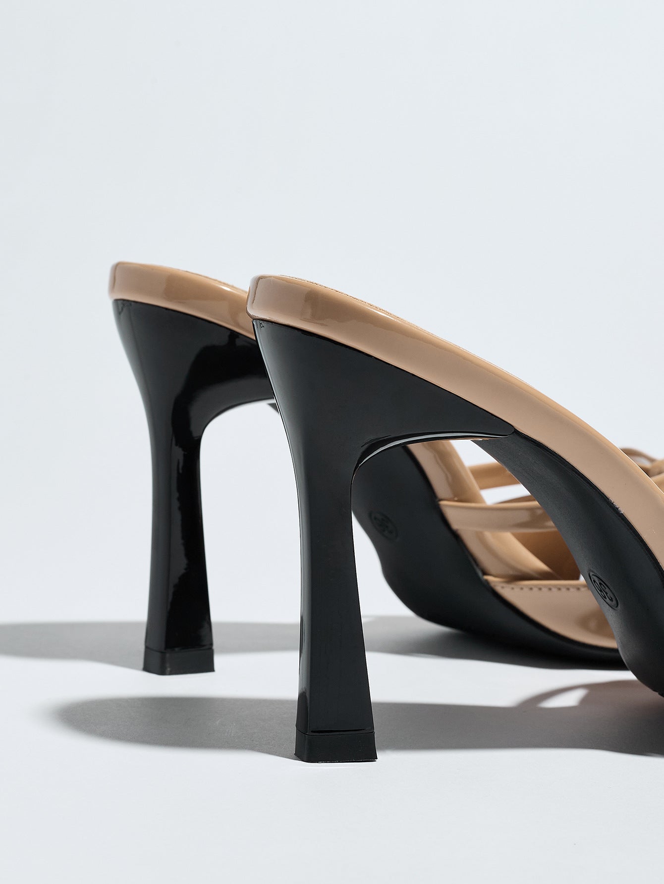 Mescini apricot bow pointed toe stiletto mules, close crop of the heel shape, US women's sizes