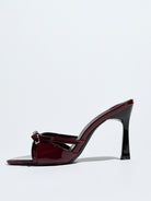 Mescini burgundy bow pointed toe stiletto mules, single shoe in full side view, US women's sizes