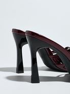 Mescini burgundy bow pointed toe stiletto mules, close up of the flared heels, US women's sizes