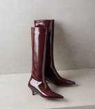 Mescini burgundy kitten heel knee high boots, the pair standing next to each other, US women's sizes
