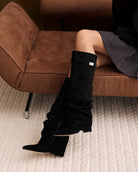 Mescini black slouchy knee high boots, pair seen from the front, zip open, US sizes