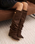 Mescini dark brown slouchy knee high boots, angled pair view on a pale floor, US sizes