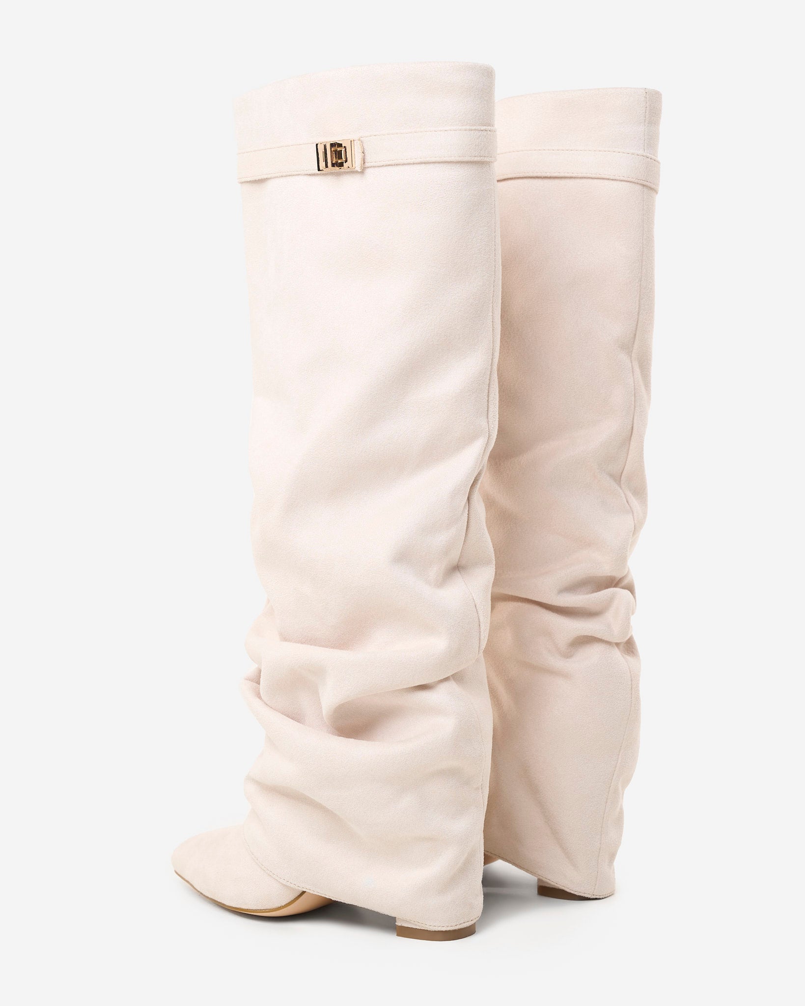 Mescini cream slouchy knee high boots, worn by a model seated on a bench, US sizes