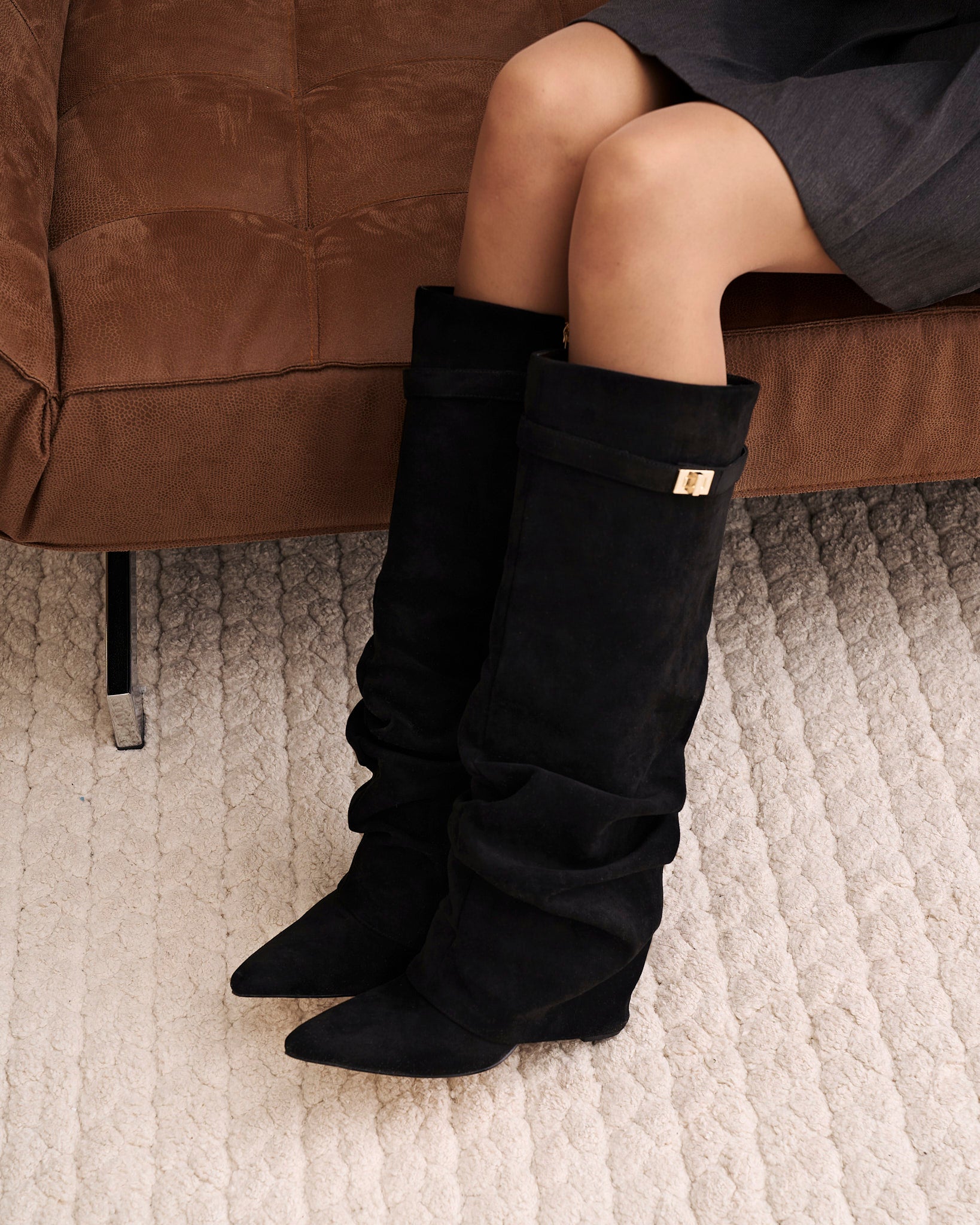 Mescini black slouchy knee high boots, angled pair view on a pale floor, US sizes