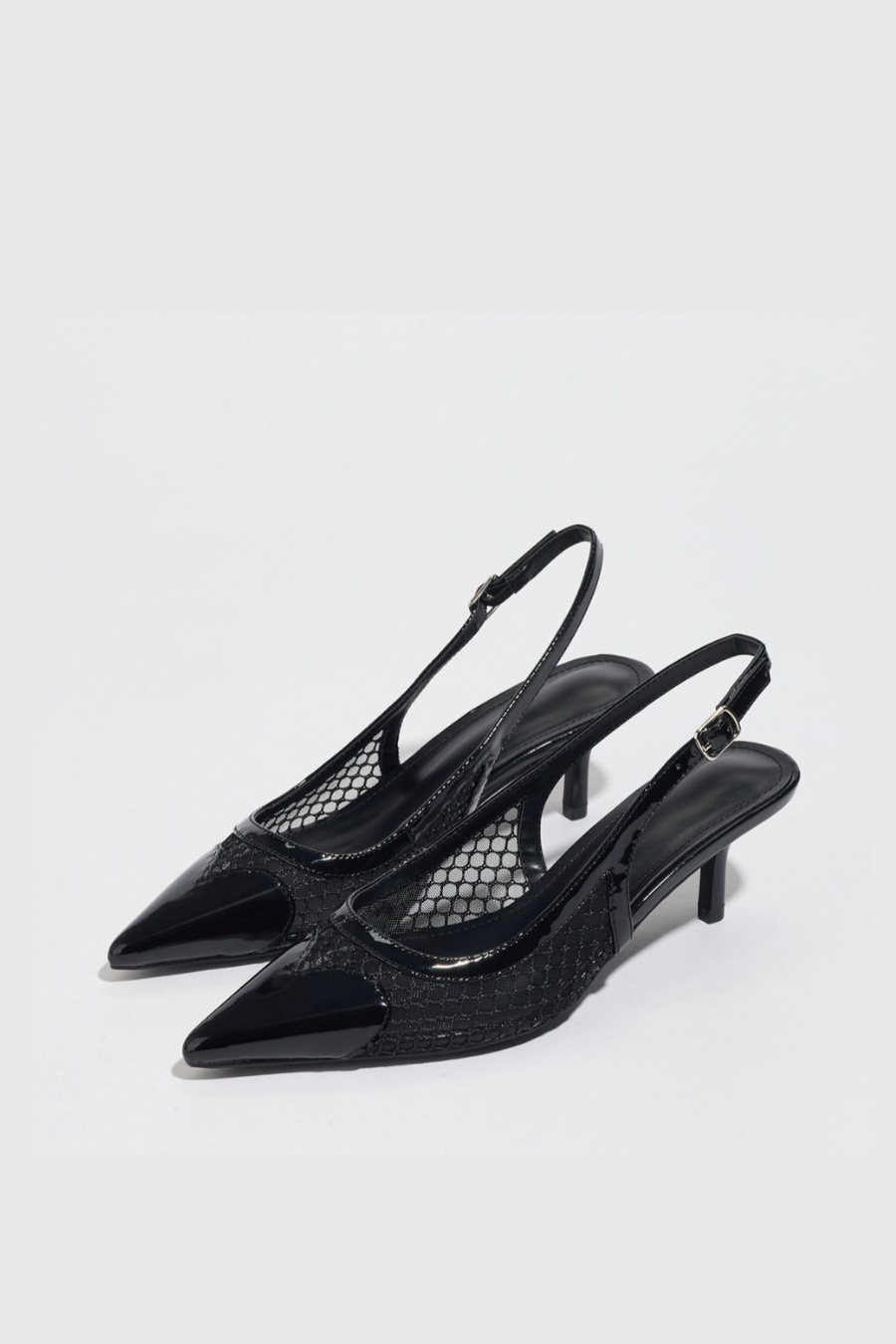 Mescini black mesh pointed toe slingback kitten heels, angled pair on a pale grey backdrop, US women's sizes