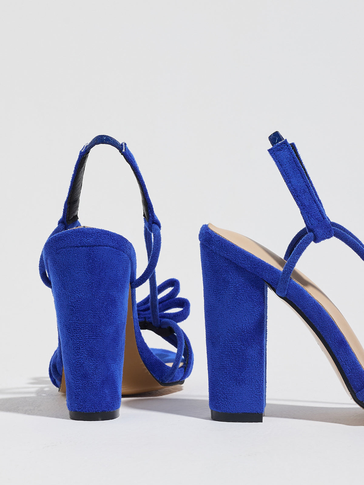 Mescini blue knotted bow strappy block heel sandals, seen from behind at an angle, US women's sizes
