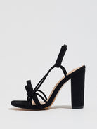 Mescini black knotted bow strappy block heel sandals, full side view of one shoe, US women's sizes