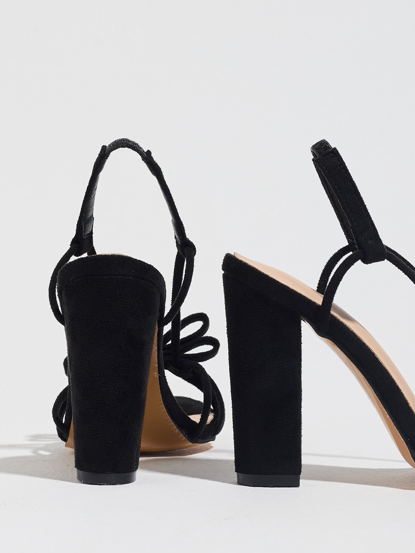 Mescini black knotted bow strappy block heel sandals, seen from behind at an angle, US women's sizes