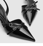 Mescini black patent pointed toe kitten heels, close up of the sharp tips and buckle straps, US women's sizes