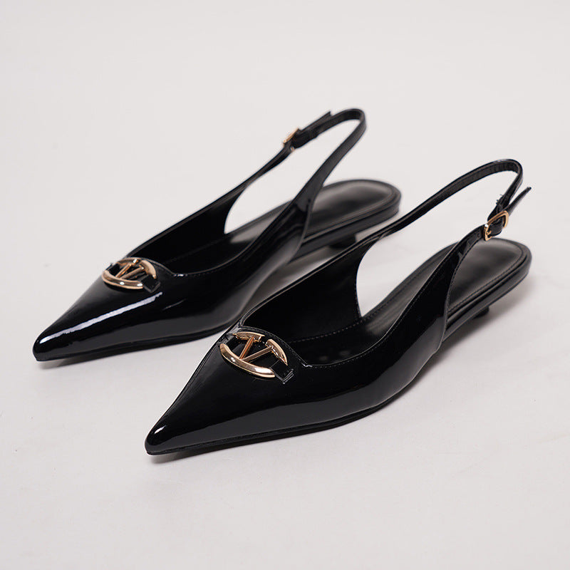 Mescini black pointed toe buckle slingback flats, pair on a white surface seen from behind, US women's sizes