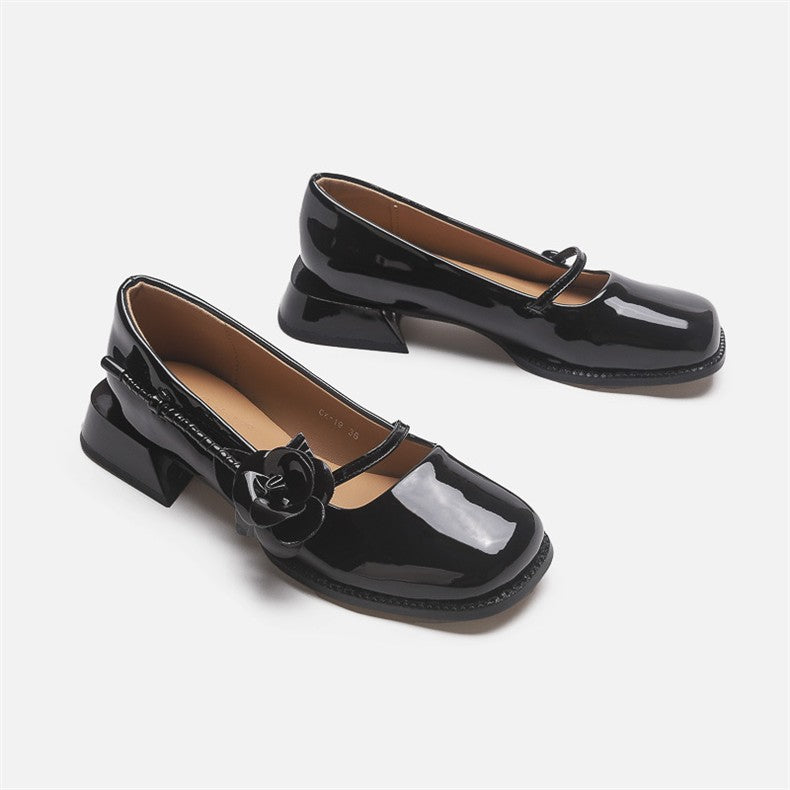 Mescini black rose square toe mary jane heels, the pair angled to show the flower trim, US women's sizes