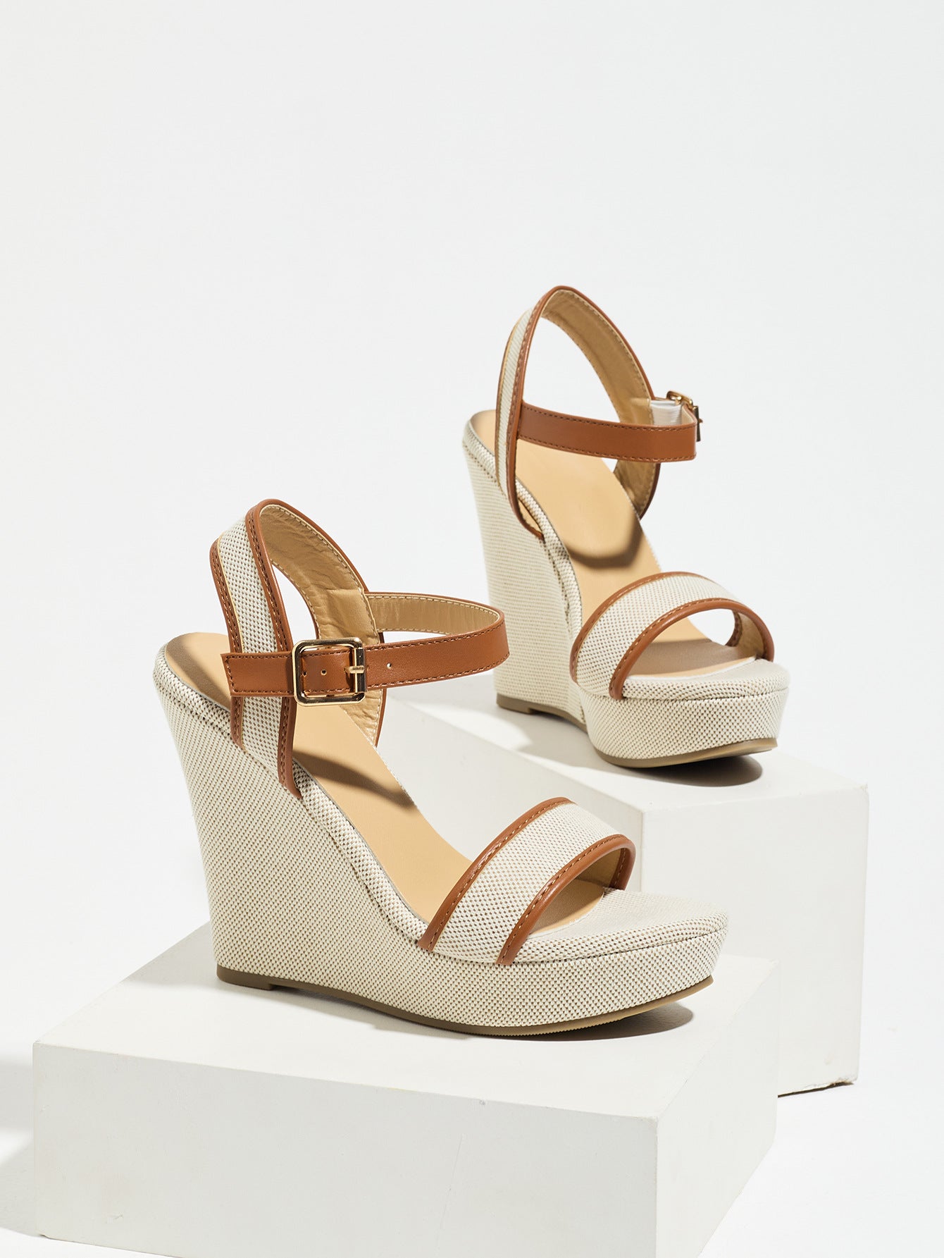 Mescini brown canvas platform wedge sandals, one shoe posed on a white riser, US women's sizes