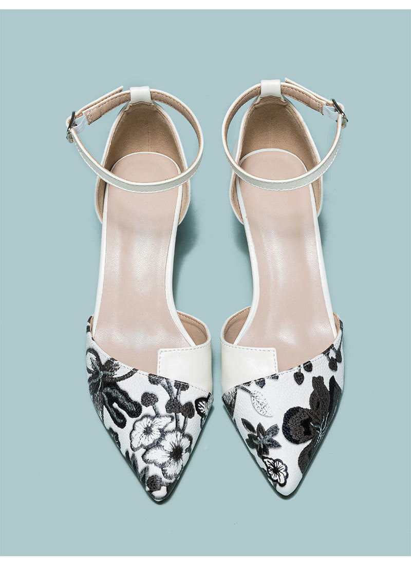 Mescini white embroidered floral ankle strap pumps, pair seen from directly above, US women's sizes