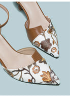 Mescini brown embroidered floral ankle strap pumps, close crop of the needlework, US women's sizes