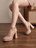 Mescini nude ankle strap platform block heel pumps, worn by a seated model, legs crossed, US women's sizes