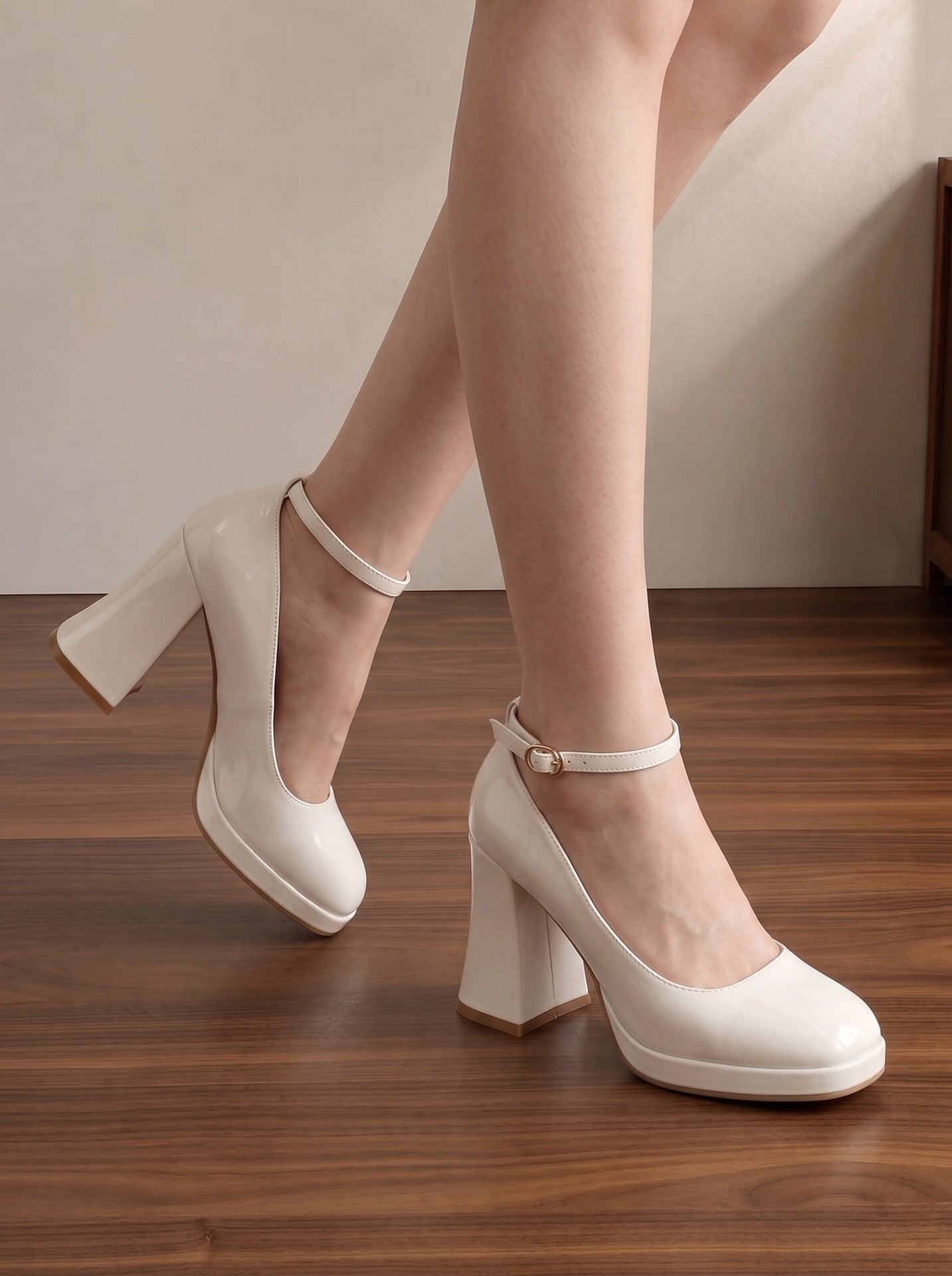 Mescini white ankle strap platform block heel pumps, worn with one foot lifted behind, US women's sizes