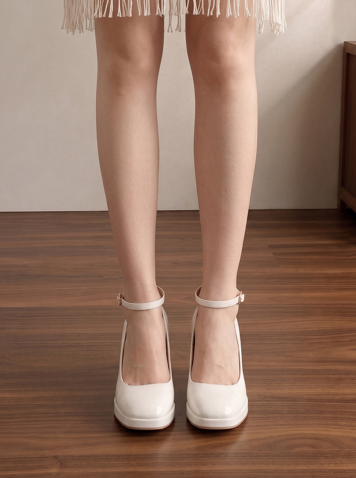 Mescini white ankle strap platform block heel pumps, worn standing, seen from behind, US women's sizes