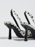 Mescini white polka dot slingback stiletto heels, rear view of the ankle strap and buckle, US women's sizes