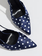 Mescini navy polka dot slingback stiletto heels, close up of the satin pointed toes, US women's sizes